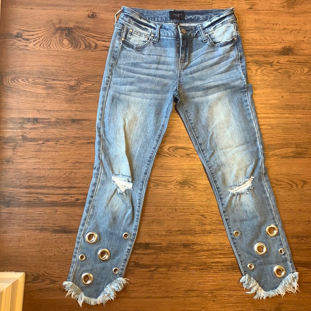 Size 26 skinny jean with silver cutouts and fringe